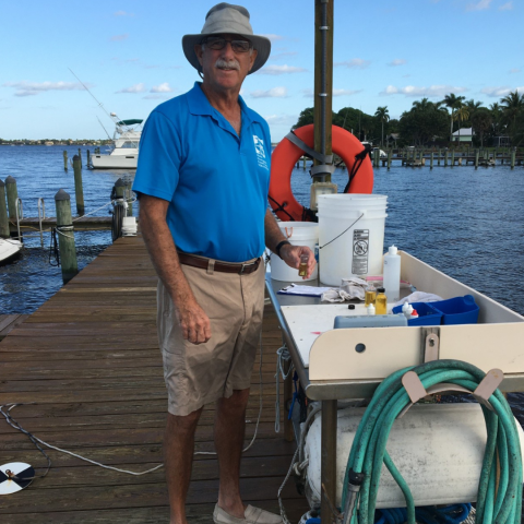 older man standing on pier